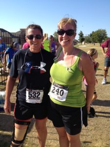 At the Buddy Run 5K finish line with my running partner. This is the first of many races we would run together.