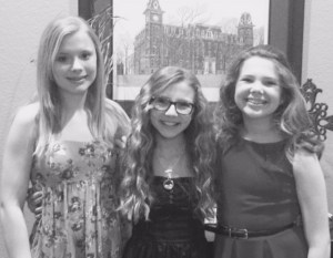 All smiles taking a picture with friends before Valentine Dance 2015. 